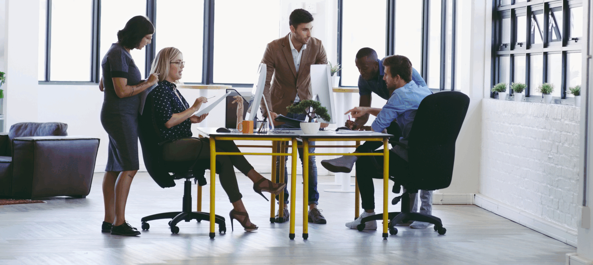 Office team collaborating around a table.