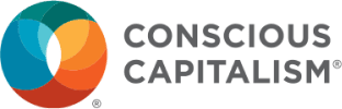 Logo of Conscious Capitalism with an orange and blue heart symbol.