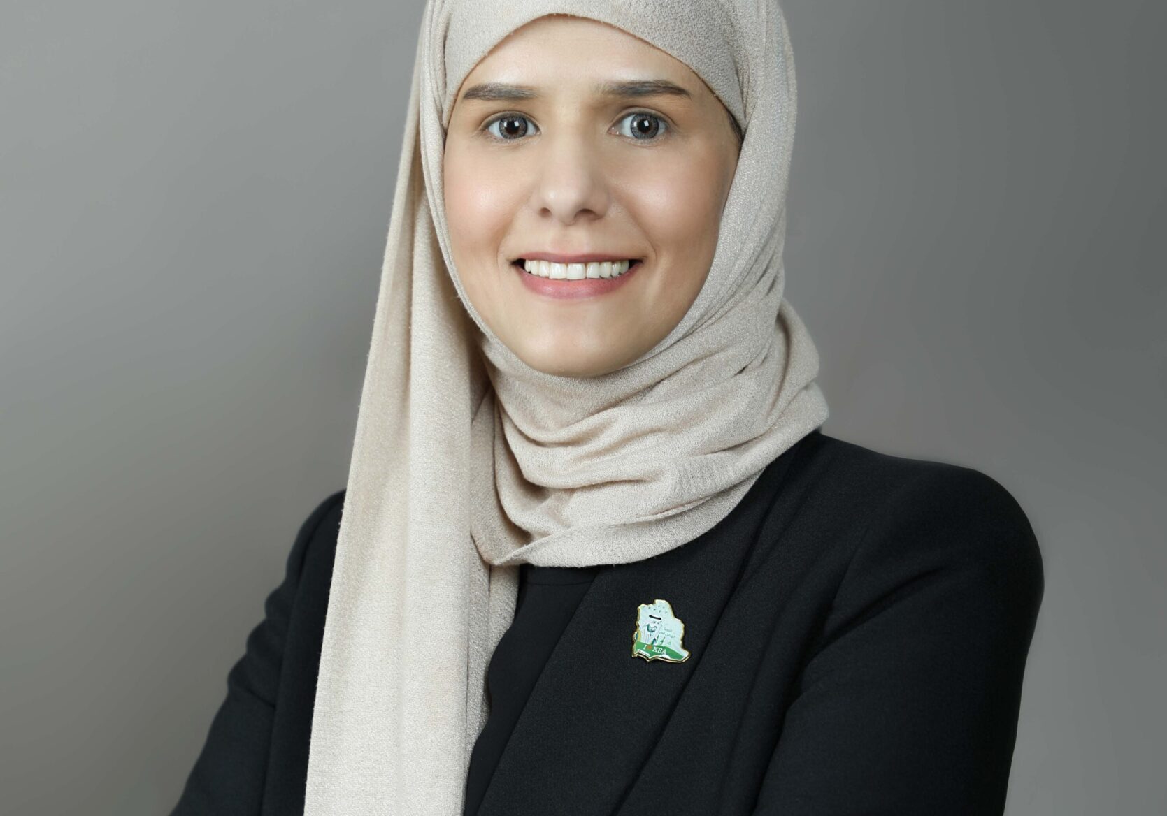 Person in a hijab and black suit.