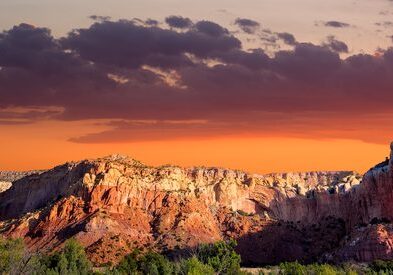 Desert landscape with colorful sunset sky.