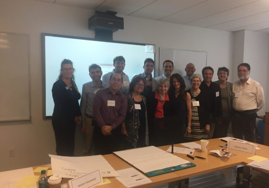 Group photo in an office meeting room.