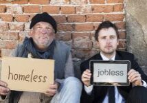 Two men holding homeless and jobless signs.